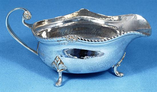 A George V Arts & Crafts silver sauce boat, by Albert Edward Jones, length 185mm, weight 7.3oz/228grms.